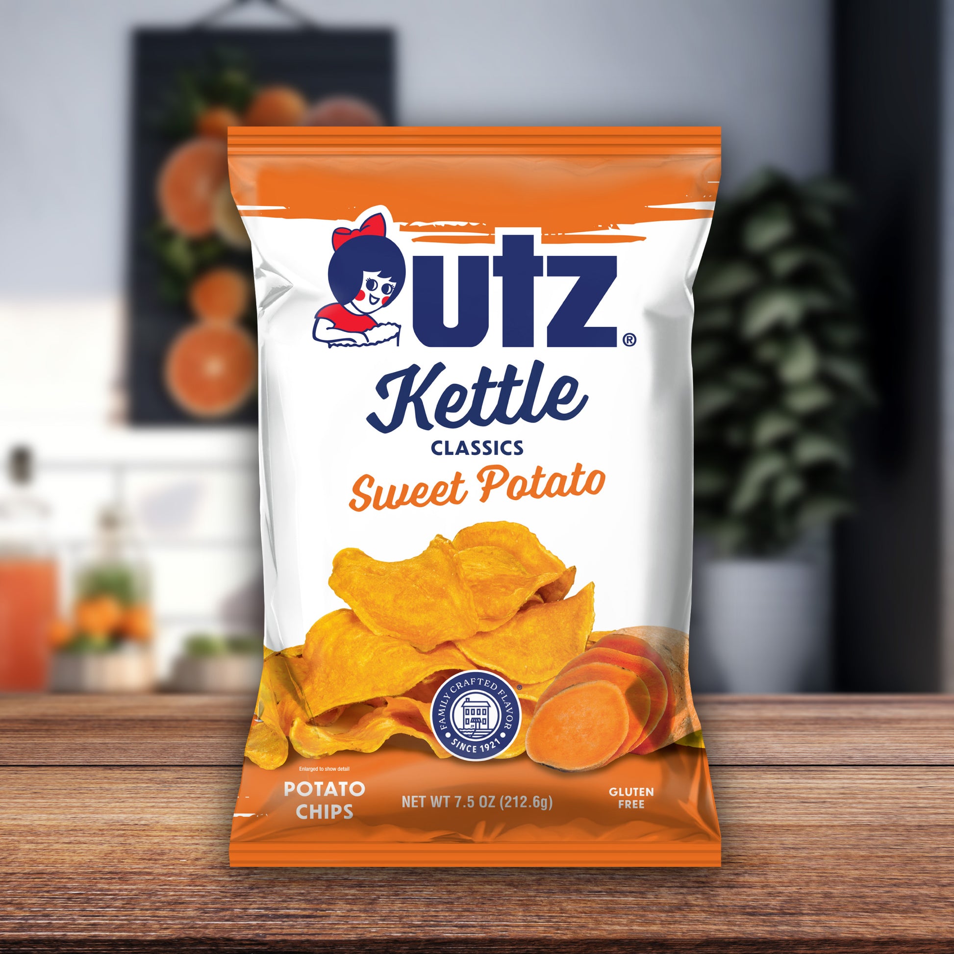 UTZ Kettle Classics Sweet Potato chips packaging on a wooden surface with a blurred background