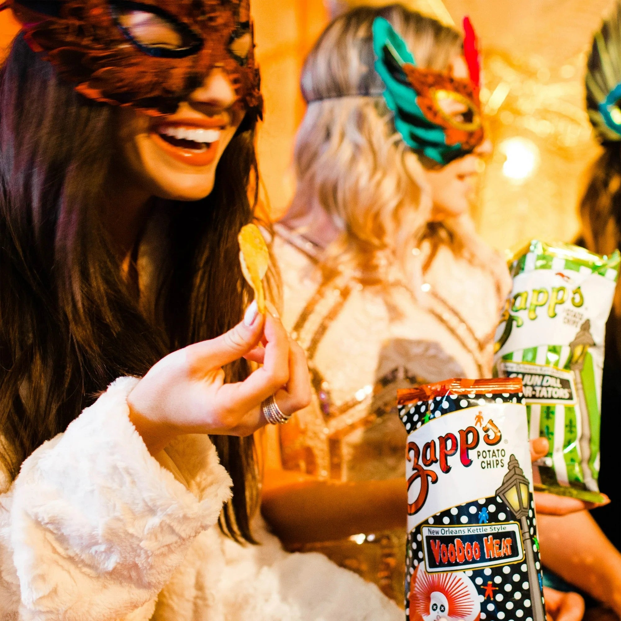 People wearing masks with Zapp's potato chips in the foreground